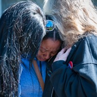 Charmaine Lawson is hugged by supporters shortly before addressing students, faculty and the community on the HSU Quad on Friday, the 23-month anniversary of the killing of her son, David Josiah Lawson.