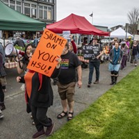 Demonstrators unhappy with the firing of KHSU staffers and the suspension of local programming gathered into a protest walk around the farmers market area.