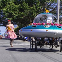 A flying saucer festooned with rhododendrons for the parade.
