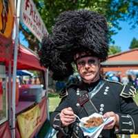 Andrew Endsley enjoys some haggis at the Highland Games on Sunday.