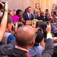 Gov. Gavin Newsom, crowd at signing ceremony for use-of-force bill.