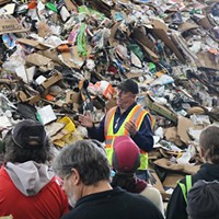 Chuck Schager speaks to a group about the new recycling changes during a tour of Recology's materials recovery facility Nov. 10.