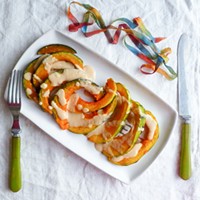 Roasted winter squash with tahini dressing.