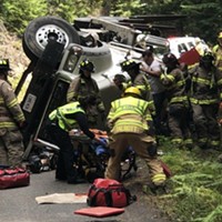 A logging truck flipped on Kneeland Rd.