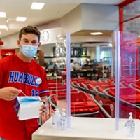 Target employee and Eureka High School senior Hayden Bode provides masks and hand sanitizer for shoppers who do not have one at no cost.