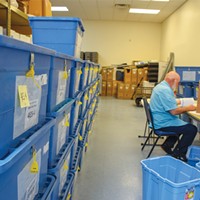 Boxes of ballots wait to be processed and counted at the Humboldt County Elections Office in 2018.