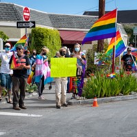 About a dozen people came out to fight hate on the corner of H and 18th streets in Arcata on Friday after posts on Nextdoor and social media told of a Pride Flag that was displayed in a garden on the same corner had been burned.
