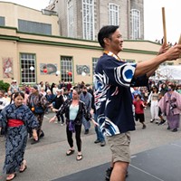 Franco Imperial, visiting from San Jose Taiko, beats the big taiko as the bon odori dancers circle the stage in front of the Arcata Playhouse on Sunday, Aug. 14.