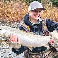 Amber Bray of Brookings, Oregon, landed an early-arriving hatchery steelhead while fishing the Chetco River Monday.