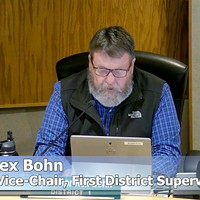 First District Supervisor Rex Bohn reads a prepared apology.
