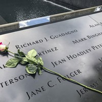 A single rose sits by Richard Guadagno's name at the 9/11 Memorial in New York City in 2019.