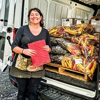 Harvest Hub Coordinator Hailee Nolte packs up the van to make deliveries.