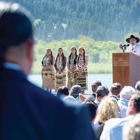 From left to right: Erica Young, Aleaha Aguilar, Chu-cheesh O'Rourke and Faith Kibby stand sentry as Yurok Tribal Chair Thomas O'Rourke speaks at a signing celebration last month for a new agreement to remove four dams from the lower Klamath River. Photo by Mark McKenna