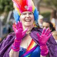Parade marshal Linda Shapeero brought the color with her Pride ensemble and signature rainbow earrings.