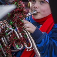 Jude Carter, 6, of Eureka, played in his fourth TubaChristmas performance, along with his father and grandmother, in front of a crowd of 100 or more at the Gazebo in Old Town Eureka on Saturday, Dec. 3