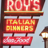 The neon sign at Roy's, now dark.