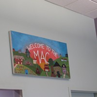 A sign welcoming visitors to the MAC.