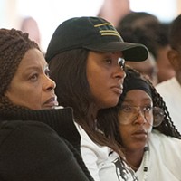 Josiah Lawson's mother, Charmaine, and grandmother listen to a speaker at the 2017 memorial service.