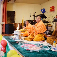 Monks from Wat Lao Saysettha, a Buddhist temple in Santa Rosa, deliver the New Year blessings and prayers.