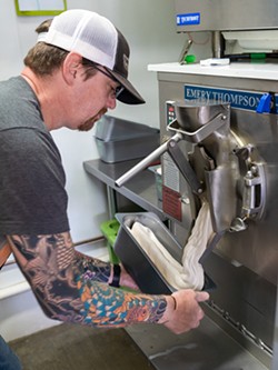 PHOTO BY ZACH LATHOURIS - Shawn Powers whips up a batch of cinnamon ice cream.