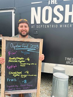 PHOTO BY ALYSSA MASTERSON. - David Orluck with his Septentrio menu board after his Oyster Fest win.
