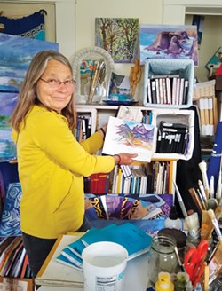 PHOTO BY LOUISA ROGERS - Jan Ramsey with her stacks of sketchbooks.