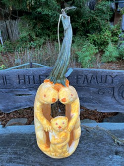 PHOTO COURTESY OF MIKE CRAGHEAD - A pumpkin carving of a family of otters.