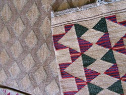 PHOTO BY LINDA STANSBERRY - Old and new: two native flat bags in Maret's collection, one twined before European contact and one after.