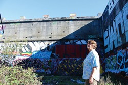 THADEUS GREENSON - Local homeless advocate Kathy Anderson stands in the graffiti-covered old concrete lumber kiln known as the Devil’s Playground.