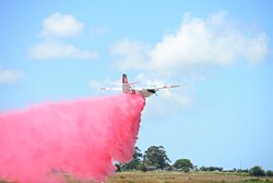 PHOTO BY MARK MCKENNA - A plane practices fire suppression techniques during a recent Cal Fire training.