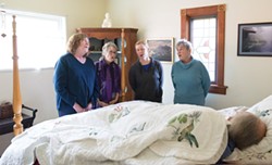 PHOTO BY MARK MCKENNA - Arcata Threshold Choir members (left to right) Lissa Anderson, Kate Green, Maggie McKnight and Jane Riggan demonstrate a bedside singing at Riggan's home.