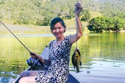 PHOTO BY KEVIN SMITH - Diane Tu with a pair of panfish.