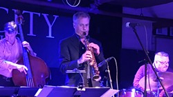 PHOTO BY BARRY EVANS - Although it looks very much like a brass clarinet, the soprano saxophone has greater range and volume. Here, the writer's stepbrother Rob Middleton plays.