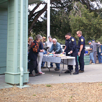 Mattole Station's CAL FIRE team checking out the dessert table at the Honeydew Elementary School Grand Slam Fundraiser